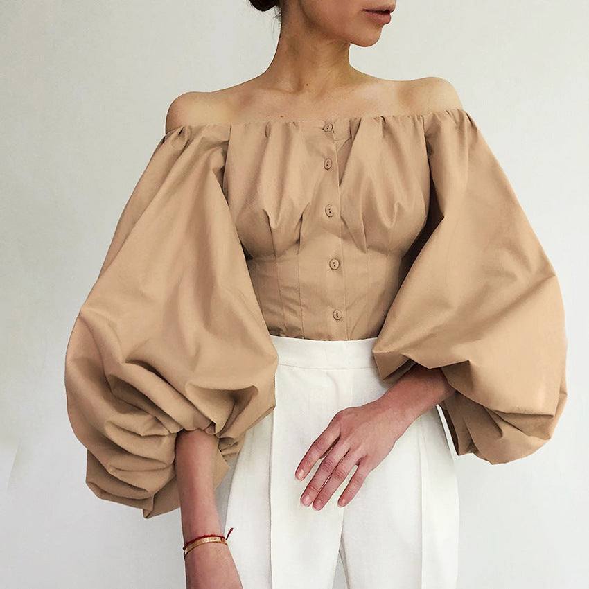 Spring and summer new design sense long sleeved bubble lantern sleeves with shoulder leakage European and American women's shirt top